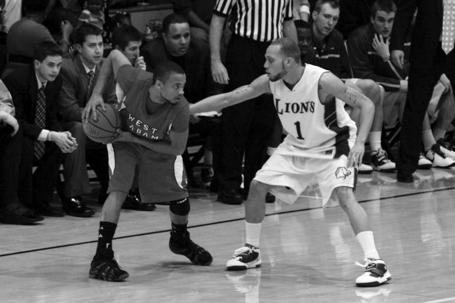 UNA junior guard Beaumont Beasley defends against an opposing player in the Lions’ game against the University of West Alabama Feb. 19. The Lions defeated UWA 90-60 at Flowers Hall.
