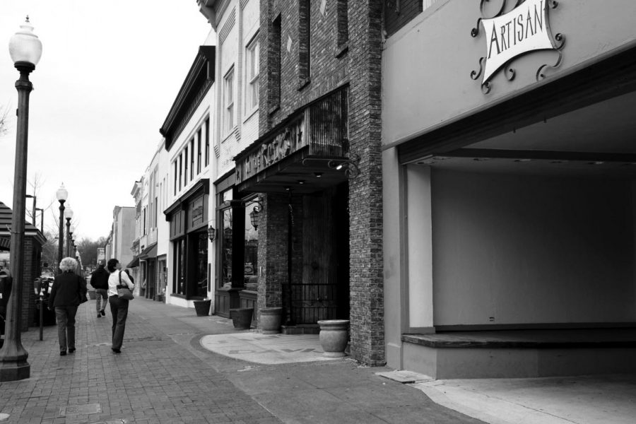 People walk down the streets of downtown Florence. The Congressional Quarterly maga- zine recently reported that the Florence-Muscle Shoals area is the safest metropolitan area in Alabama.