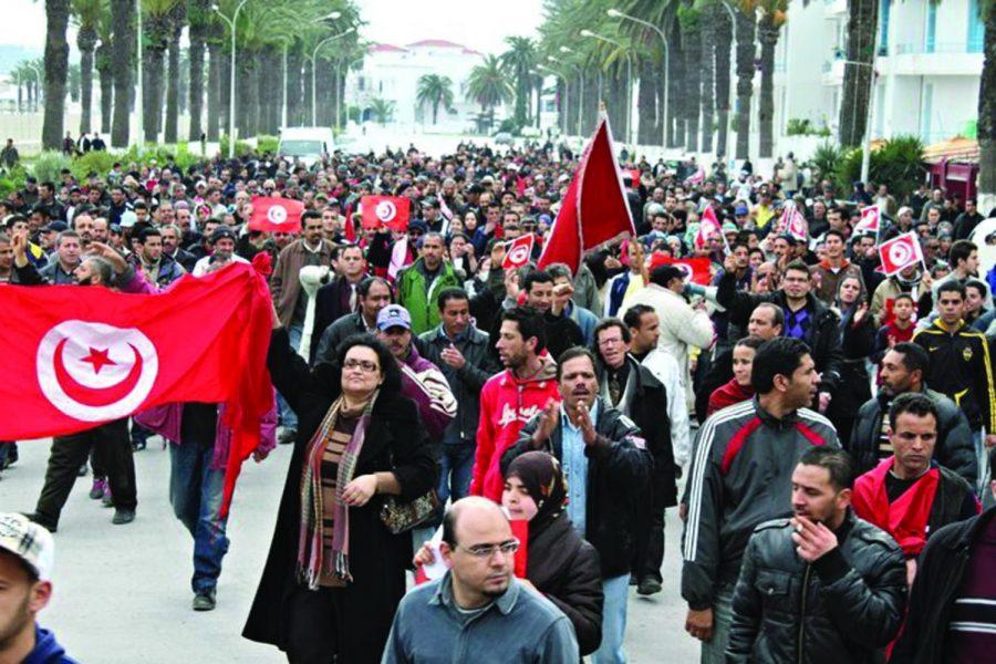 Demonstrators march near the capital of Tunisia.