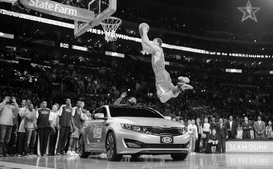 Blake Griffin dunks over a car in the 2011 Slam Dunk Competiton. He can dunk over a KIA, but he could not  carry his team into the playoffs.