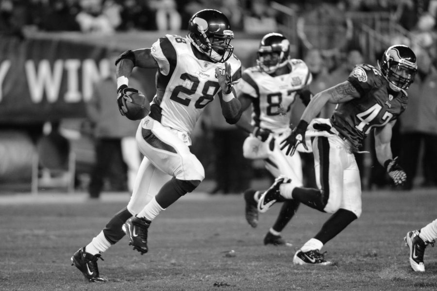 Minnesota Vikings running back Adrian Peterson carries the ball up the field in a game against the Philadelphia Eagles last season. Peterson is one of many players currently affected by the NFL lockout.