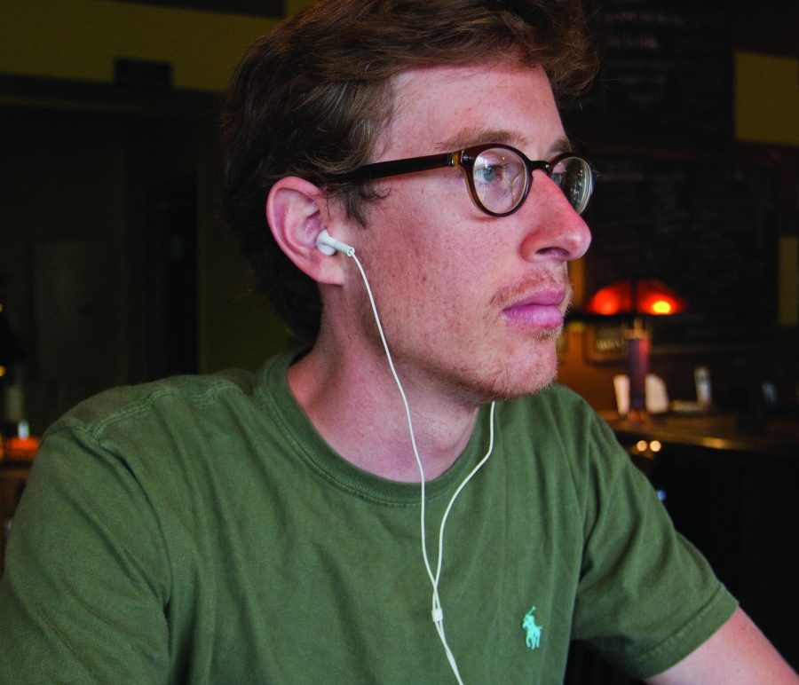 UNA student Mack Cornwell listens to music on his headphones.