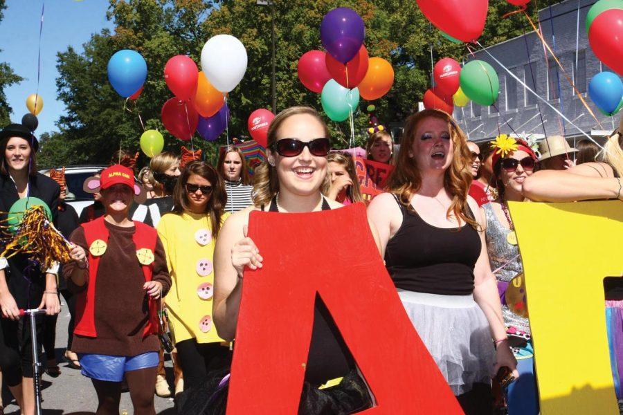 Members of Alpha Gamma Delta sorority march in the 2010
Homecoming Parade. This year’s parade will take place Sept. 24 at
11 a.m. before the football game.
