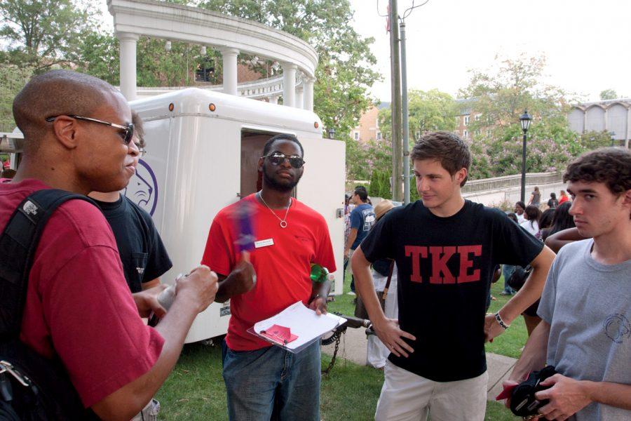 Members of TKE fraternity socializing at the Greek Block
Party.
