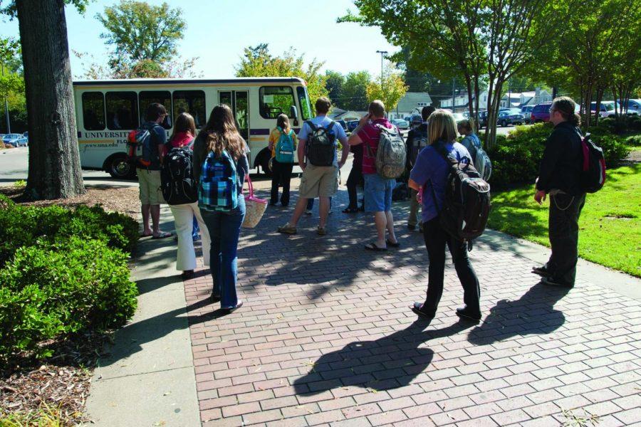 Students wait for the Lion Express shuttlebus to transport them
to the off-site parking location on Darby Drive. Students are
picked up periodically at the Harrison Plaza entrance to campus and
transported to their cars.

