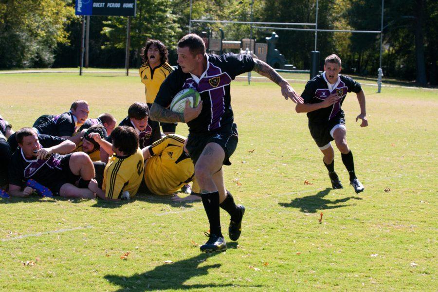  UNA rugby player Robert Gooch runs downfield for a potential
score during a game this past weekend. Rugby, bass fishing, and
paintball often go overlooked by UNA students.
