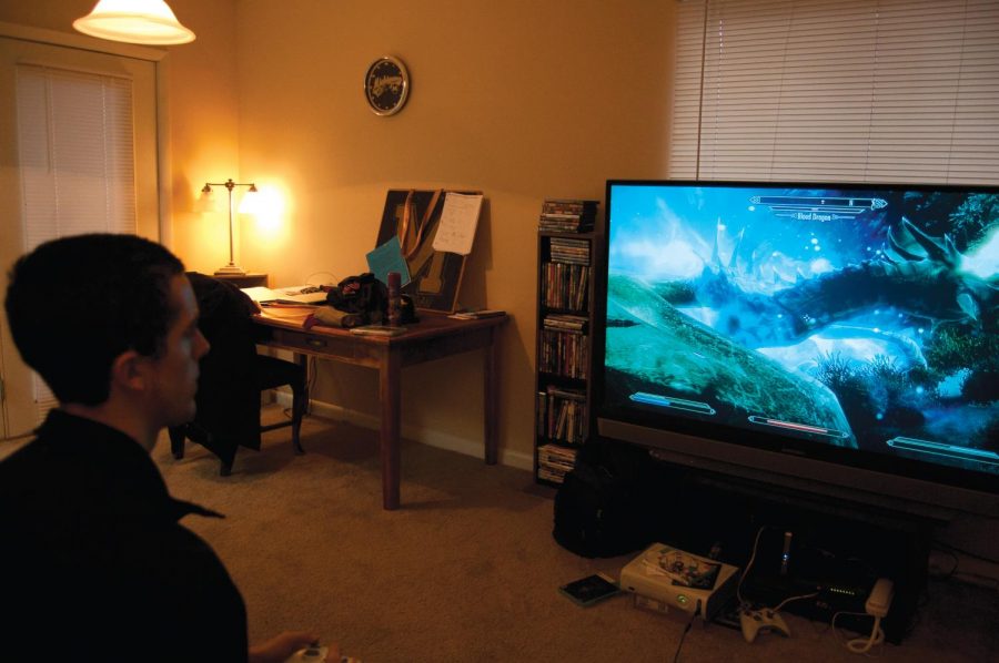 A student battles a dragon on “Skyrim,” the latest installment
in the Elder Scrolls series.
