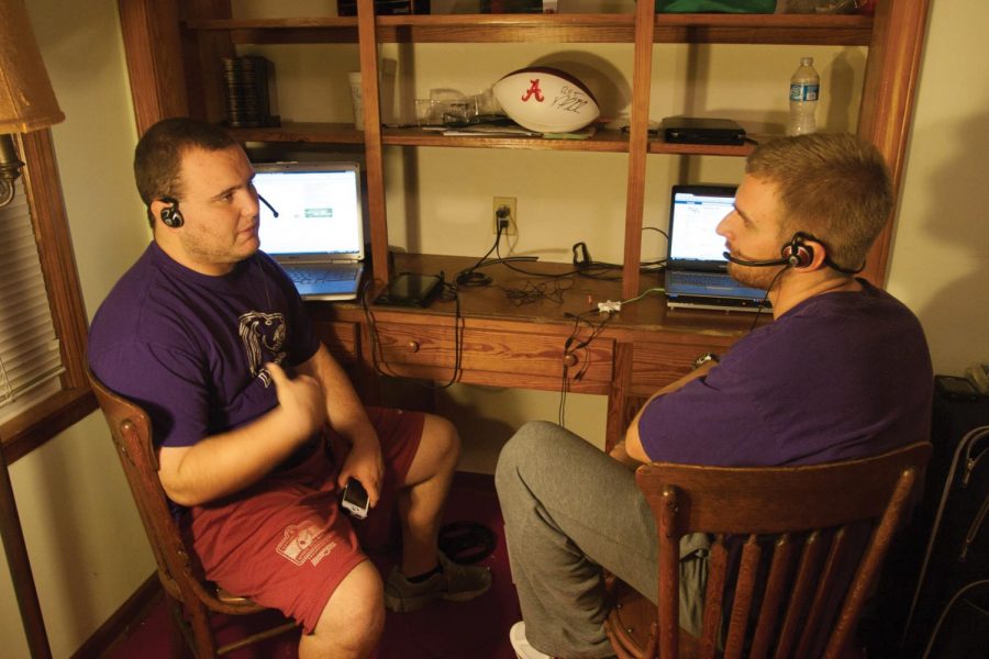Parker Hendricks (left) and Ben Stevenson (right) work on their
own sports podcast, which has gained popularity among coaches and
fans.
