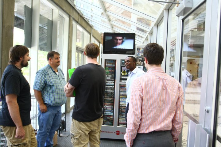 Officials install the new DVD kiosk at UNA last summer. Left to
right: Cameron Kelly-Johnson, Kenny Porter, Matthew Gibson, Ralph
Akalonu and Cory Hamilton.
