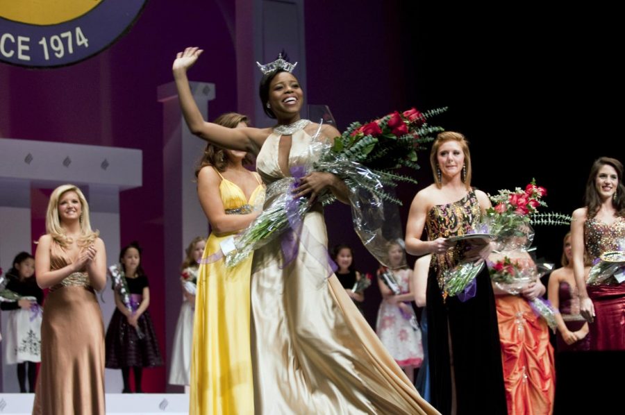 Brandi Lewis crosses the stage after being crowned last year.
Lewis’ predecessor will not only take home the crown, but a ring
she designed herself.
