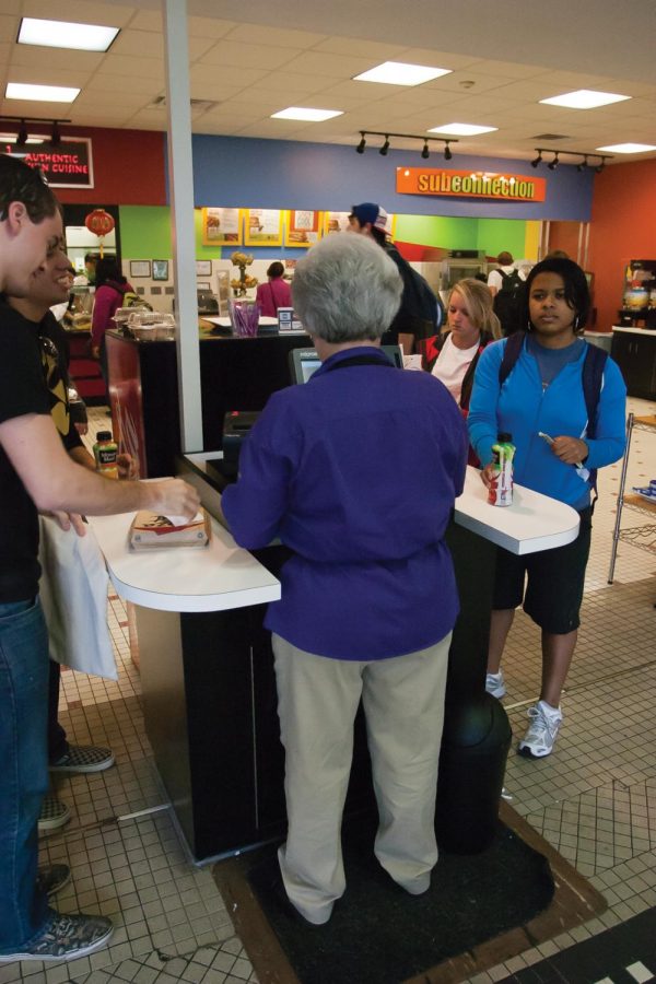 Top right, Linda Laxson rings students up using her cash register in the GUC food court.
