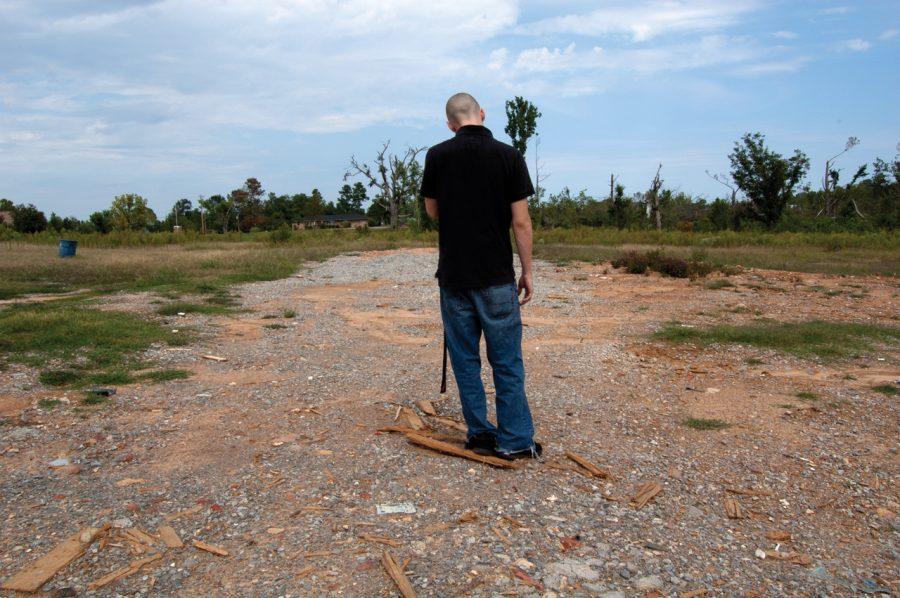 Bobby Schiavi (above) walks through the tornado-damaged parts of
Harvest five months after the storms.
