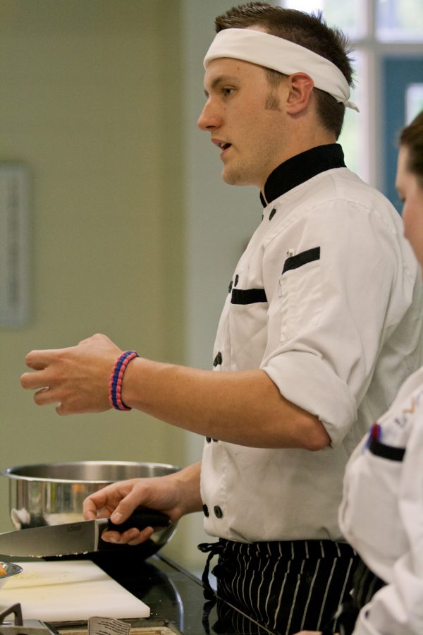 Chef TJ Seagraves demonstrates a recipe for the Culinary Department on April 12.
