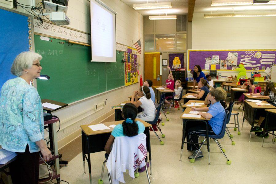 Kilby Laboratory School Teacher Mary Summy instructs her fourth grade class in her classroom.
