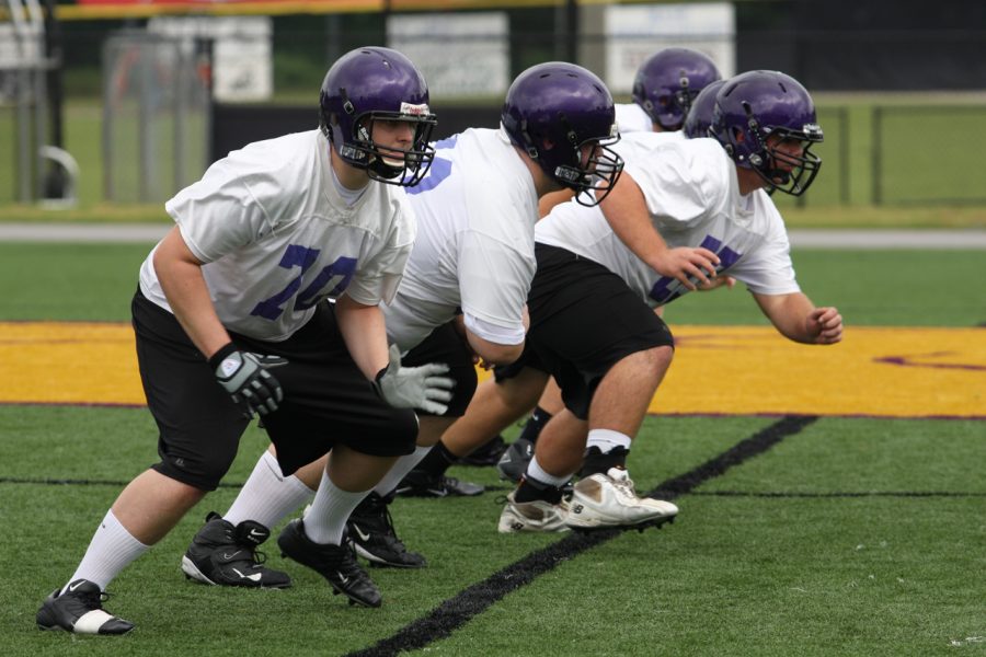 Players run plays during Thursdays practice on the UNA practice field. 
