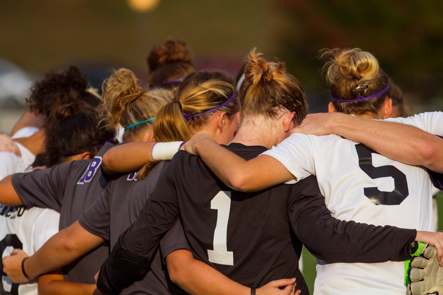 Members of the UNA soccer team huddle during Sundays brief game against Barry.

