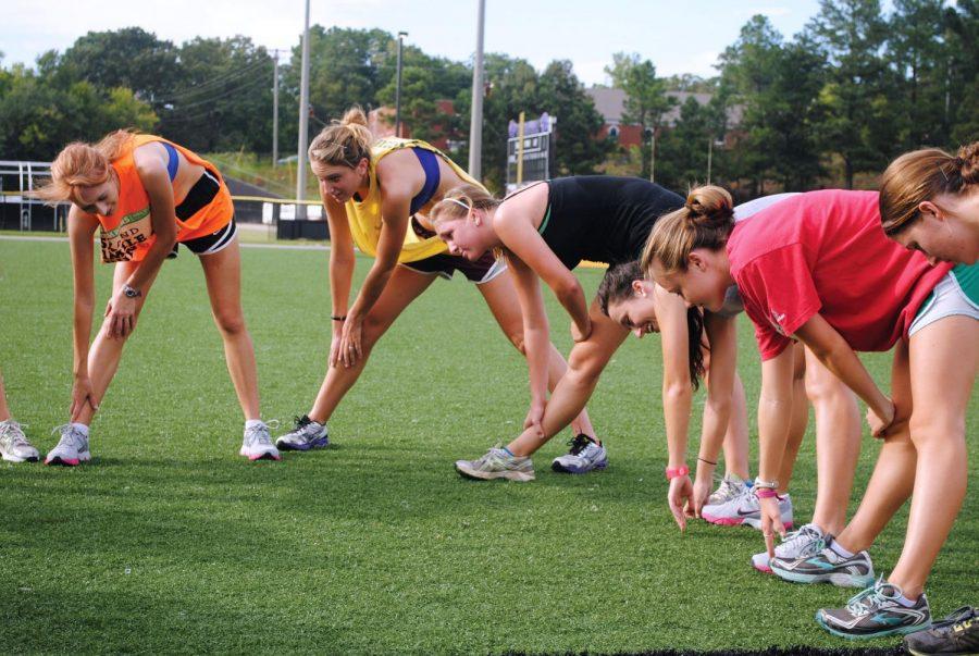 Members of the UNA Womens Cross Country team do stretching exercises before practice Aug. 29. The team will open its season at the Earl Jacoby Fleet Feet Invitational this Sept. 8.
