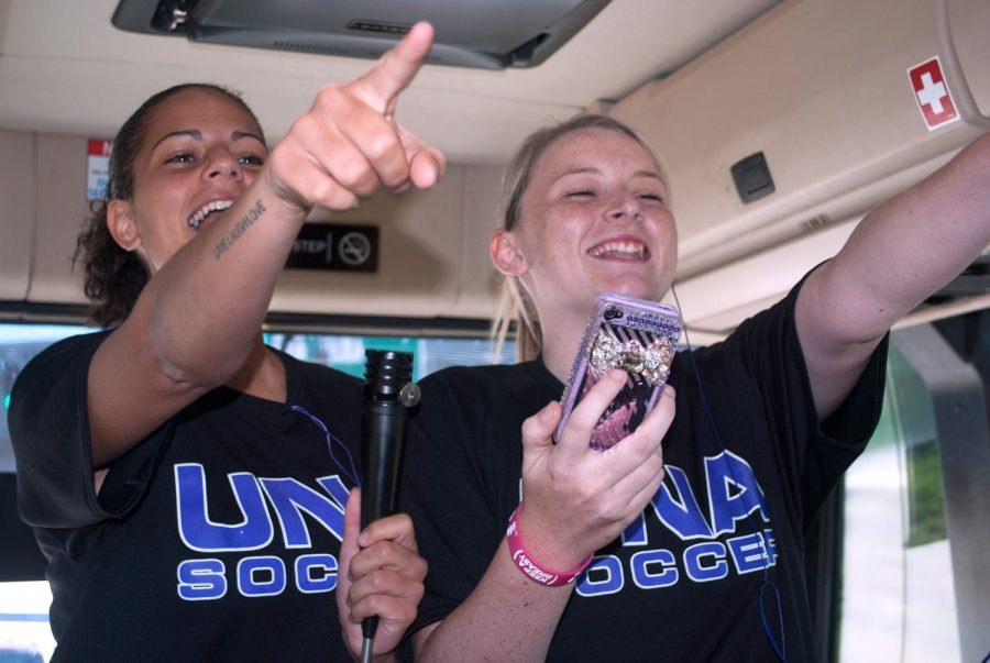 Melanie Leonida and Antonia Rigby sing karaoke on the bus headed for UAH Sunday, Sept. 9.

