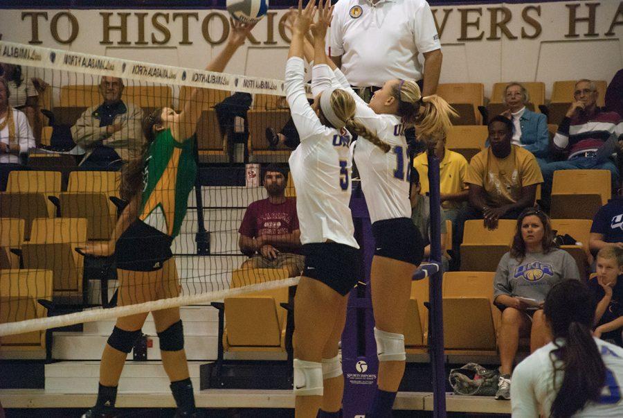 UNAs Priscilla Massengale and Taylor Chapman block the ball from Kentucky States Emily Grieshaber in the Oct. 13 game, in which the Lions won three straight sets to win the match.
