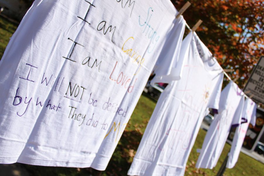 Students+decorated+T-shirts+with+anti-violence+messages+and+hung+them+around+the+Women%E2%80%99s+Center+Oct.+22+for+the+center%E2%80%99s+second+annual+Clothesline+Project+event.+The+event+was+paired+with+Take+Back+the+Night%2C+another+annual+event.%0A