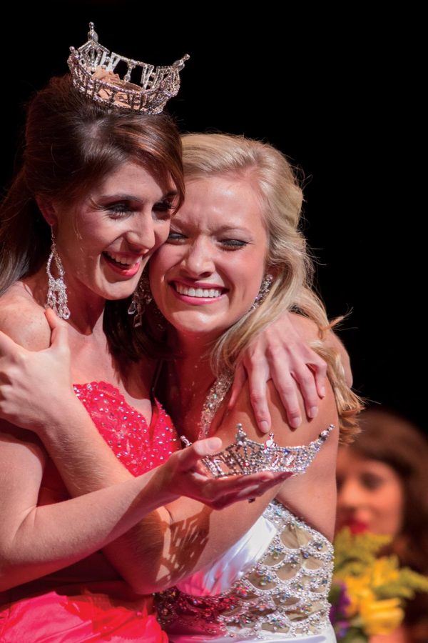 Miss UNA 2012 Anne-Marie Hall congratulates newly crowned Miss UNA 2013 Emily Winkler.
