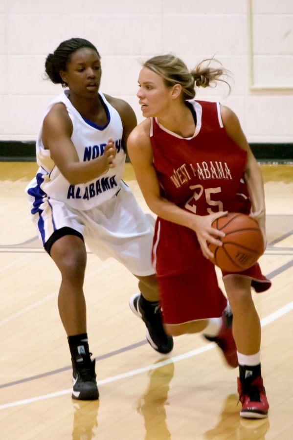 Guard Jennifer Towne tries to get the ball from West Alabama’s Anna Dill during the Jan. 26 game at Flowers Hall.
