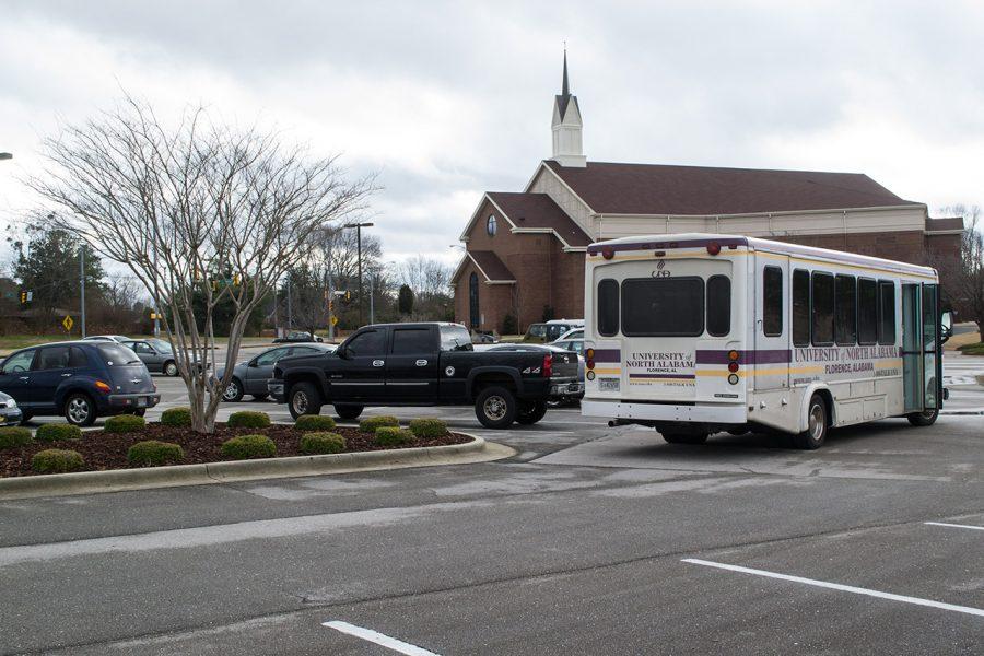A UNA shuttle bus picks up students at the new freshman off-campus parking lot at Woodmont Baptist Church on Darby Drive. Woodmont is allowing UNA freshmen to park in its parking lot free of charge to the university.
