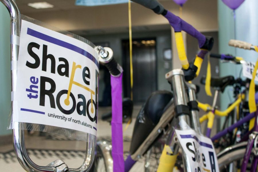A “Share the Road” campaign sign is seen taped to a bike inside the GUC Feb. 26. The campaign lasts until March 1 and is aimed at promoting bike safety and motorists being aware of cyclists.
