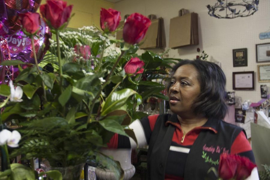 Florist Diane Rowell prepares a rose bouquet for potential customers at her downtown floral shop. Employees at Something Ele’Gant, Rowell’s floral shop, have been preparing for Feb. 14 for a few weeks, Rowell said.
