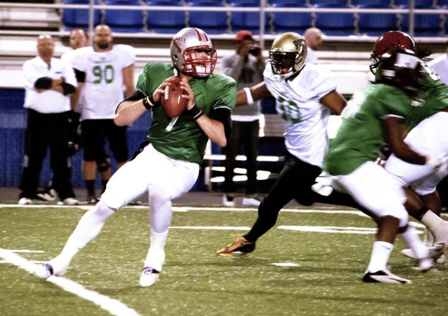 St. Xavier quarterback James Coy III, playing for the South team, looks downfield in the ProGrass International Scout Bowl in Braly stadium on March 15. The ProGrass Bowl featured top players from NCAA Divisions I and II as well as players from around the world.
