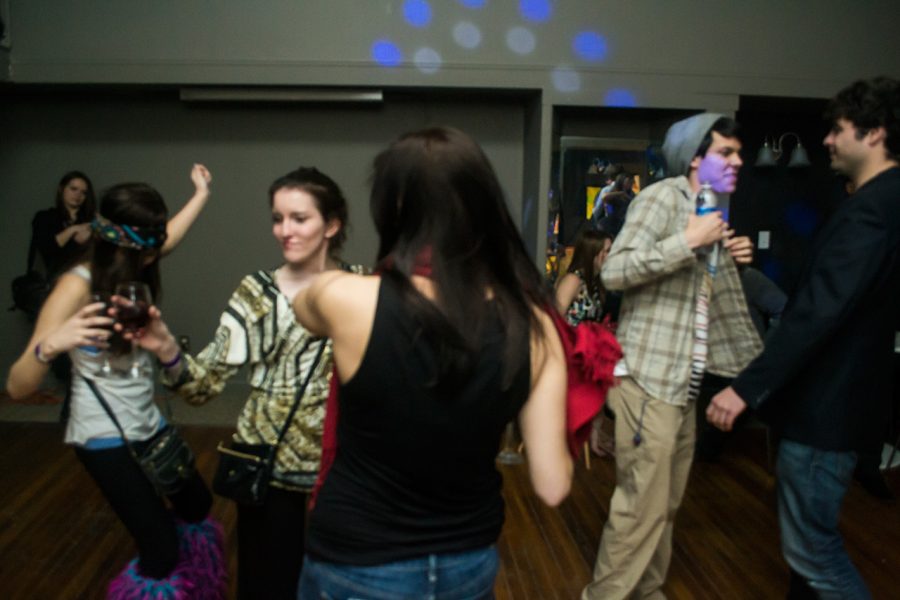 Students dance at the first event of the newly formed social group The Society. The event was designed to foster stimulating conversation and provide an alternative to hanging out at local bars where the music is too loud, said Mack Cornwell, UNA student and Society co-founder.
