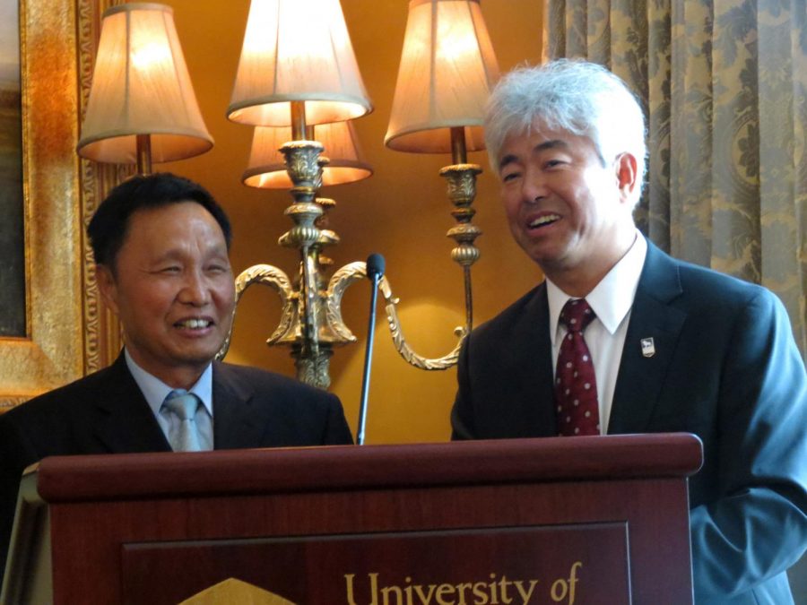 Zhang Zhiting, chairman of Guizhou Shenqi Holding Group, speaks at the press conference on Aug. 15 with UNAs Vice Provost for International Affairs Chunsheng Zhang interpreting.