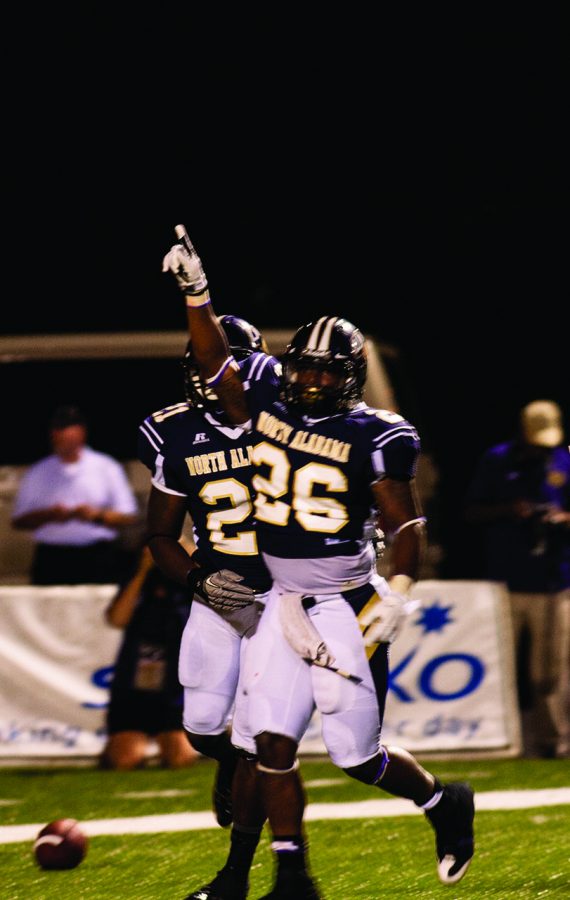 Running back Chris Coffey celebrates after making a touchdown in the third quarter of the first game of the season against Miles College on Sept. 5.