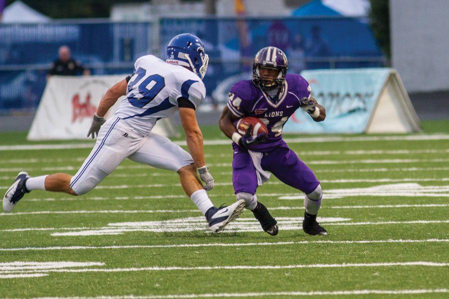 Lamonte Thompson tries to evade a tackle by Shorters Zach Mann in the Lions 2012 homecoming game. UNA will play West Georgia on Oct. 12 in Braly Stadium.