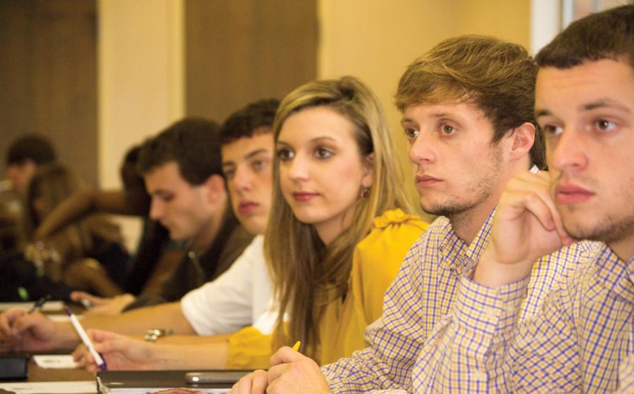SGA senators Adam McCollon, Leanne Vogel, Jensen Joiner and Nick Lang listen to discussions during their Oct. 24 meeting. One topic discussed was the denied request to name the Academic Commons Building after Larry Nelson.
