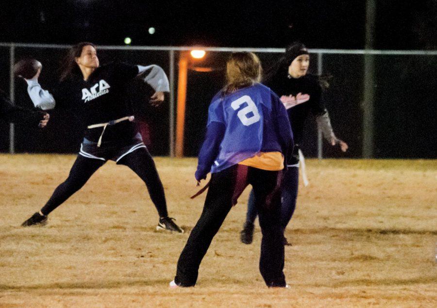 Libby Ann Olinger, quarterback for Alpha Gam 1 (Alpha Gamma Delta sorority), attempts a pass during the women’s recreational flag football championship on Nov. 13. Alpha Gam 1 along with Regime, Los Chuparcabras Turquesa and BCM (Baptist Campus Ministries) Tres won their respective championships.