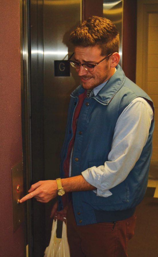Brett Burcham illustrates apprehension while using an elevator on campus. Burcham believes elevators should be checked regularly, he said.
