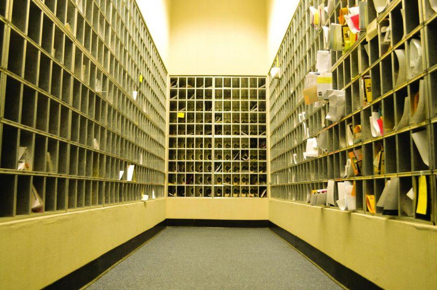 Copious amounts of packages and letters are neatly filed in their respective boxes from inside the mail room. There are 5,704 student mail boxes on campus, said Jan Hurst, university postal clerk.