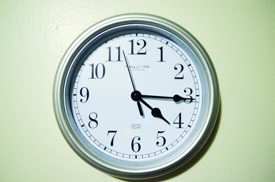 In the background a clock is set on 15 minutes after the hour, depicting the first myth.