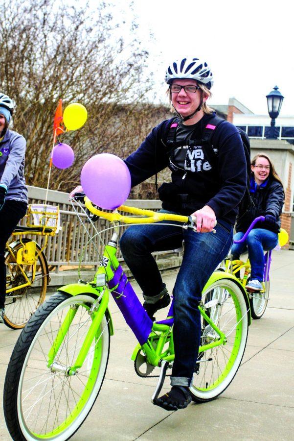 A group of students participate in the OACs Share the Road bicycle parade.
