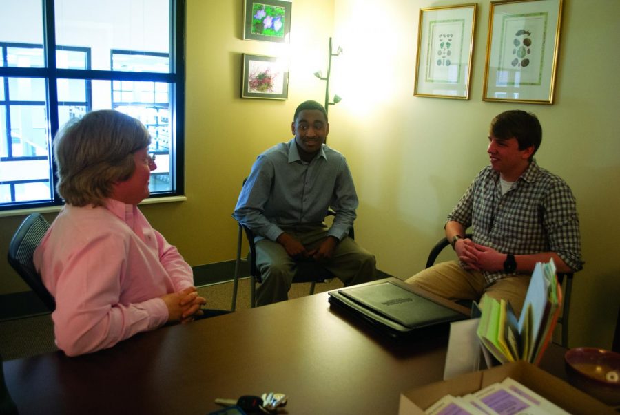 Amy Crews, director of University Advising, discusses the University Success Center’s new location with sophomores Alton Colvin and Ethan Feener, who are also employees of the center.