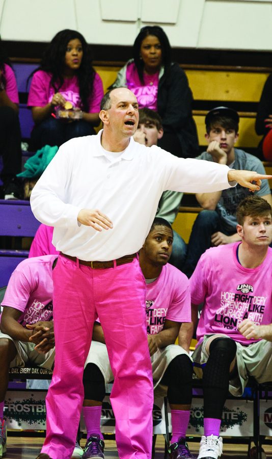 Bobby Champagne, head coach for the mens basketball team, shouts from the sidelines during UNAs annual Pink Game.
