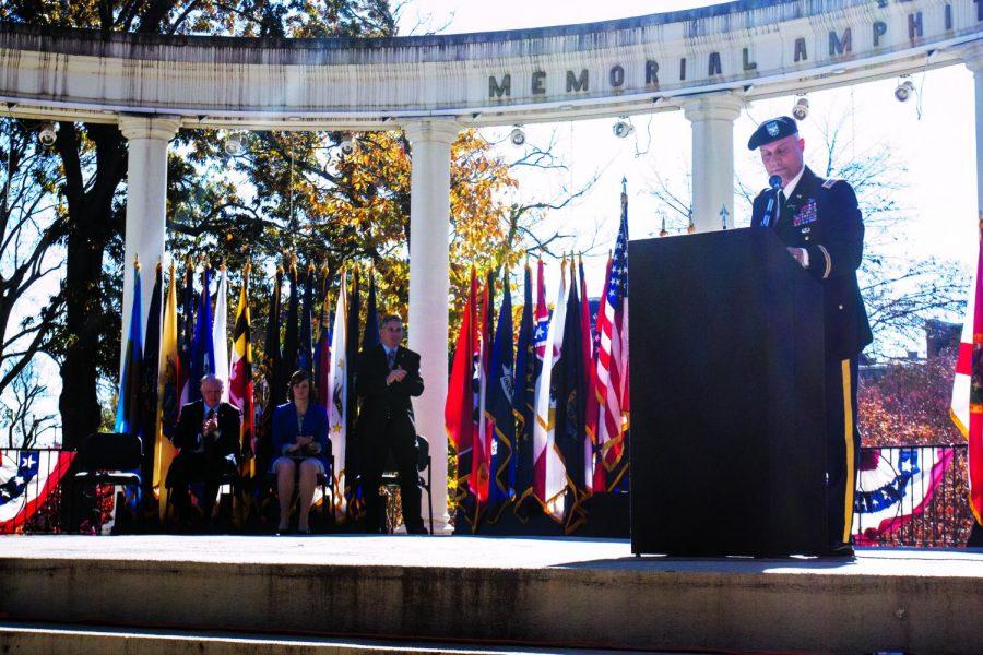 Vice President of Academic Affairs John Thornell, Student Government Association President Laura Giles and retired Lt. Col. Wayne Bergeron listen to Col. Carl Brook speak during the 2013 Veteran’s Day ceremony.