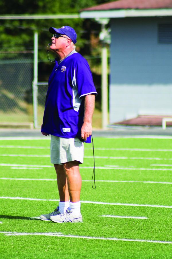 Head football coach Bobby Wallace sounds his whistle during a fall practice. Wallace is entering his No. 13 season as head coach of the Lions.