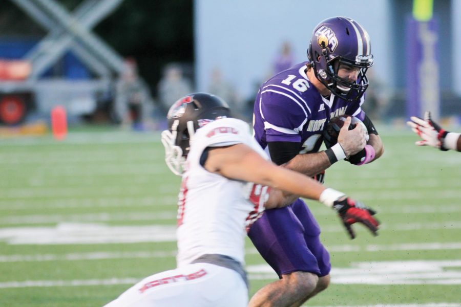 Sophomore quarterback Jacob Tucker absorbs a hit from a Western Oregon University defender Oct. 4. In his first career start at UNA Tucker finished with 190 total yards and two touchdowns.