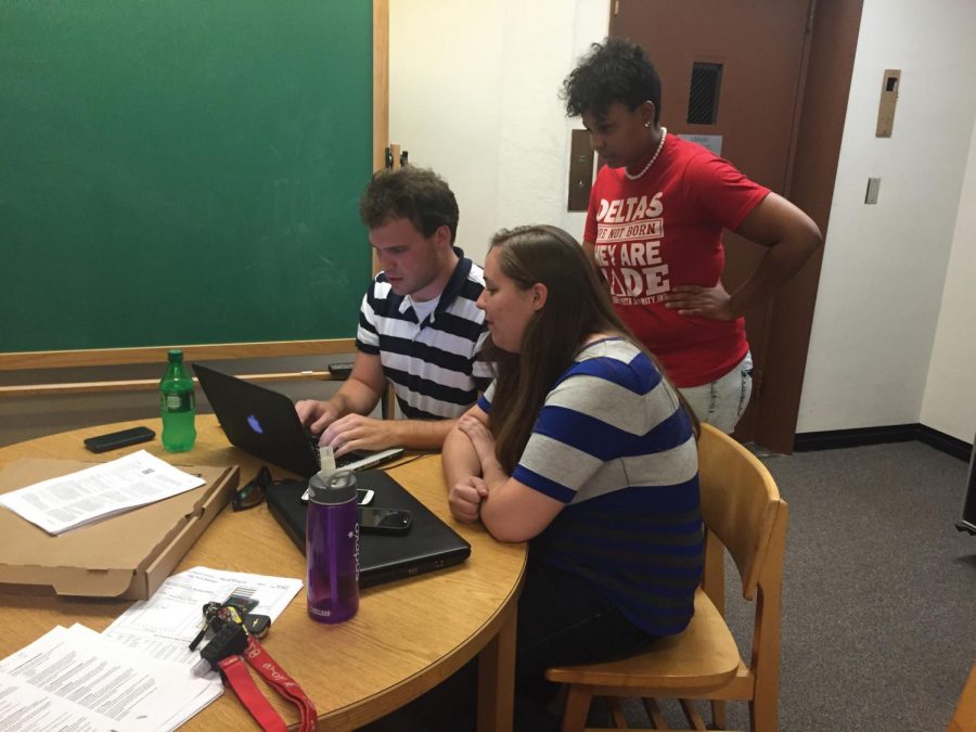 Students Jordan Graham, Mesha Kelley and Katie Hartman study late at night in the basement of the library. Senior Jacob Johnson said the library should be open 24/7 to allow students with hectic work schedules to study.