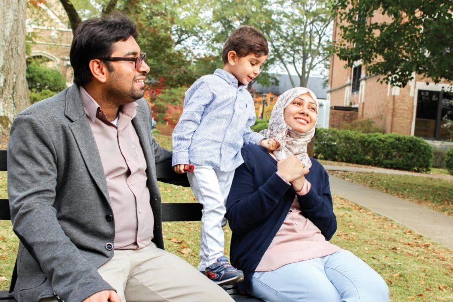 Fadil Al-Hassan and Atikah Al-Hassan playing with their son Rawad. They were interviewed about balancing being a student and full-time parent.