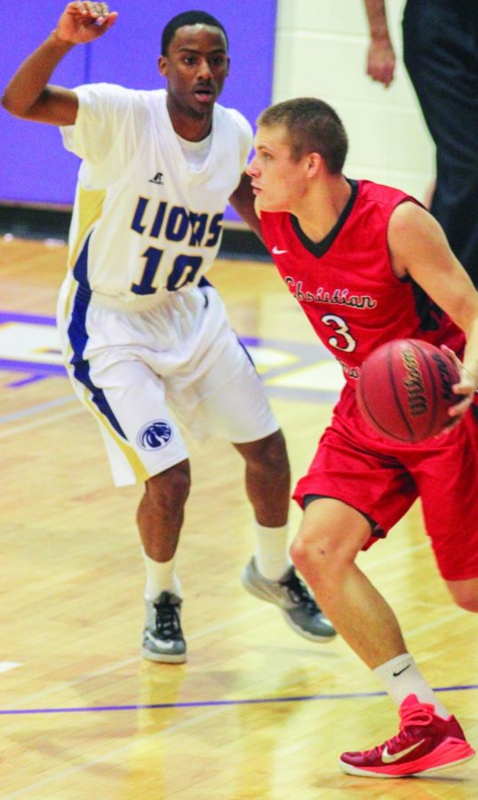 Junior guard John Fletcher defends a Christian Brothers University player Jan. 10. The Lions lost 62-61 but turned around and defeated Union University Jan. 12 to close out the four-game home stand. The Lions plan to carry the momentum on the four-game road trip beginning Jan. 15.