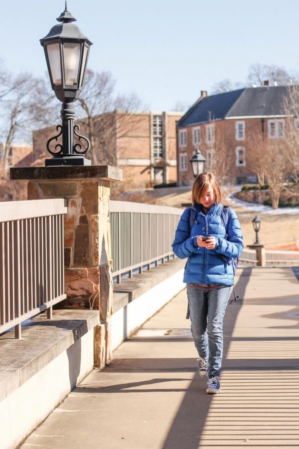 Freshman Maddie Palmer crosses the bridge outside LaGrange Hall March 5. The bridge reopened at the end of February after being closed for more than seven months. The closing came as part of the construction of a walkway to the new science building.