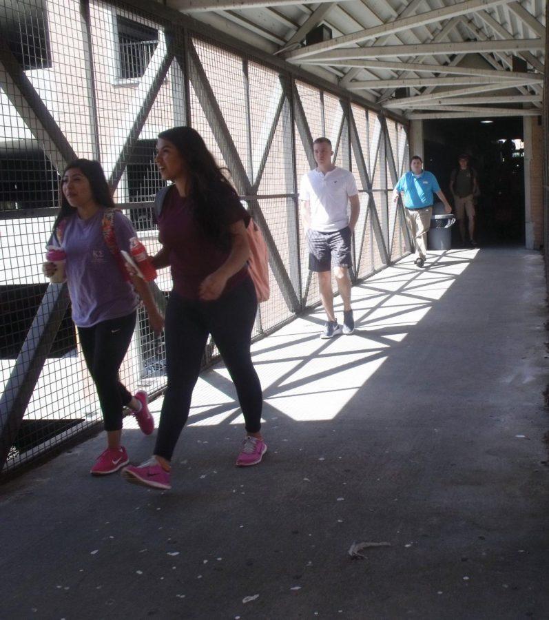 Students walk out of the on-campus parking deck March 30. In the past five years, 58 crimes have occurred in the structure, according to UNA Police Crime Logs. University officials announced earlier this month security cameras will be added before the end of the summer.